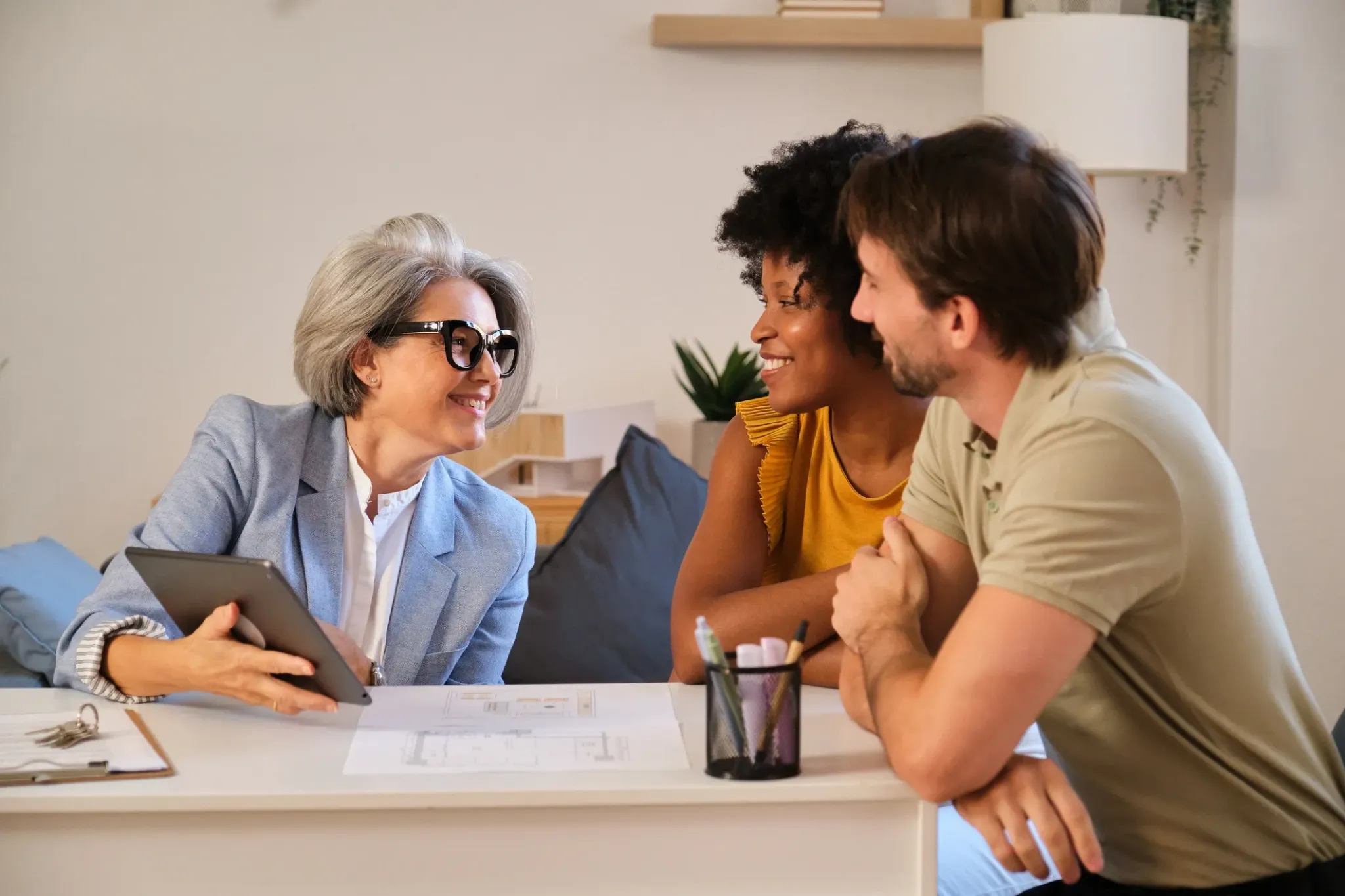 Home buyers discussing their property search with an adviser