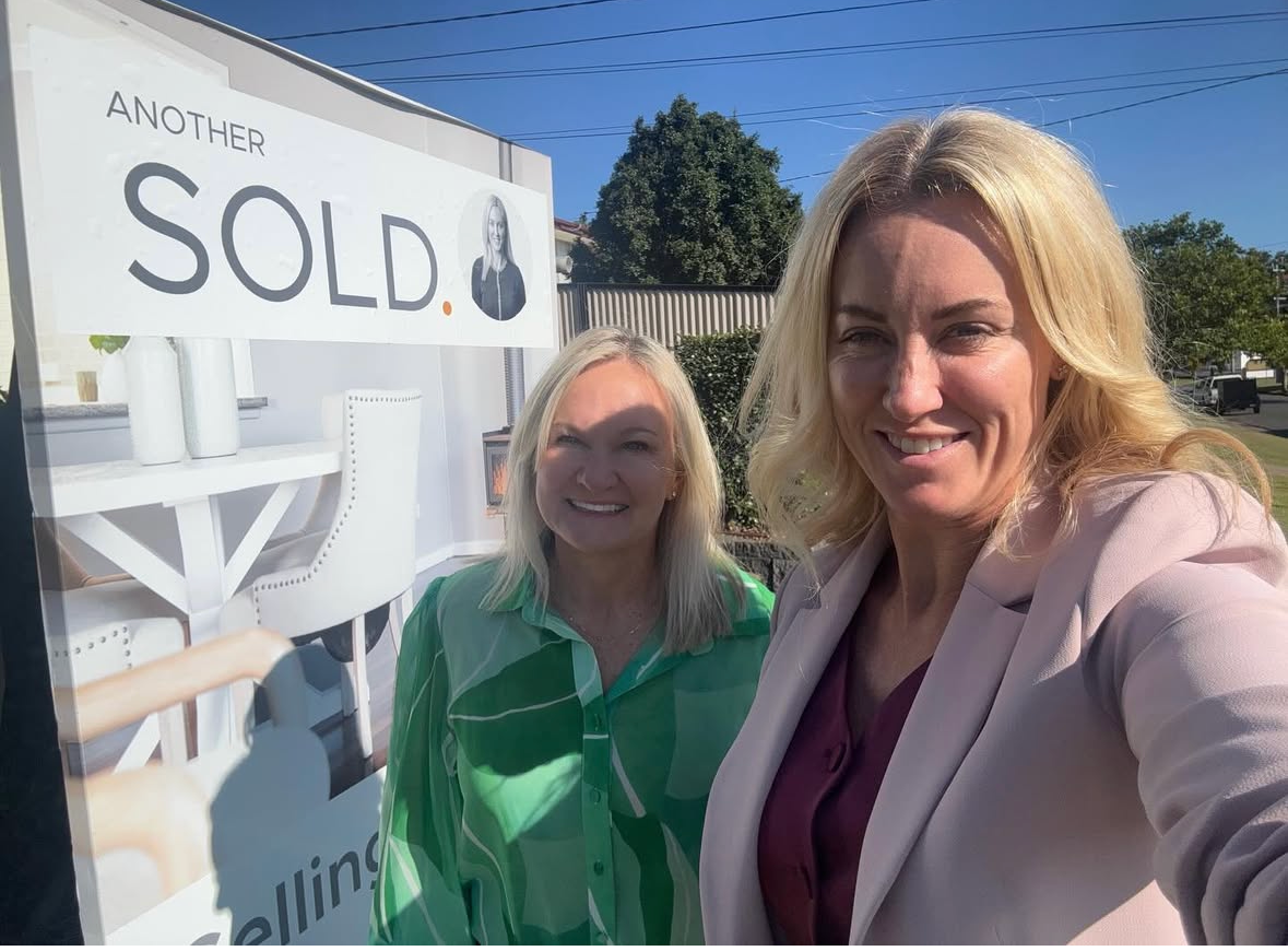 Happy clients celebrating their property purchase